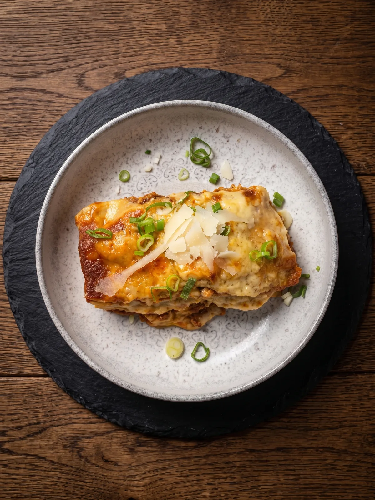 Slow-Cooked Beef Cheek Lasagna — Layers of pasta and rich, slow-cooked beef cheeks baked to perfection. A hearty, satisfying Italian comfort food classic.